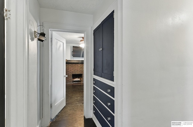6920 N 30th St, Omaha, NE 68112 - hall featuring dark wood-type flooring and a textured ceiling