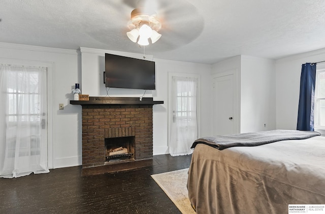 6920 N 30th St, Omaha, NE 68112 - bedroom with multiple windows, a brick fireplace, wood finished floors, crown molding, and a ceiling fan