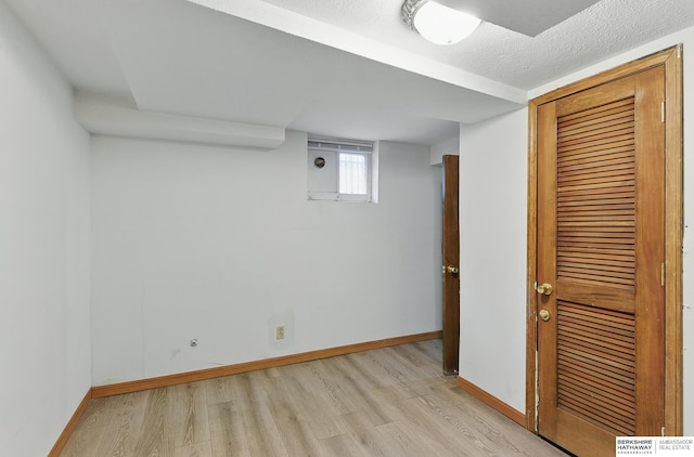 6920 N 30th St, Omaha, NE 68112 - below grade area with light wood finished floors and baseboards