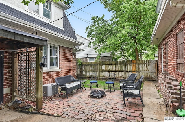 6920 N 30th St, Omaha, NE 68112 - view of patio with a fire pit and central air condition unit