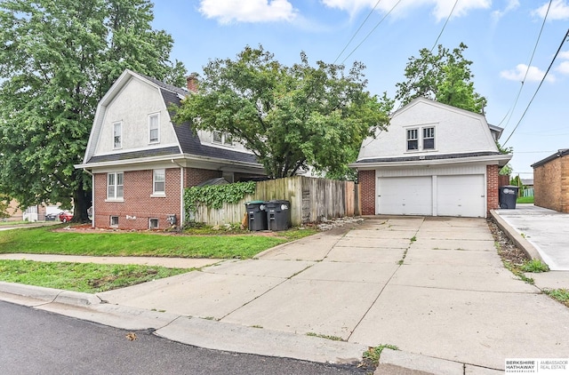 6920 N 30th St, Omaha, NE 68112 - dutch colonial with brick siding, a gambrel roof, driveway, a chimney, and roof with shingles