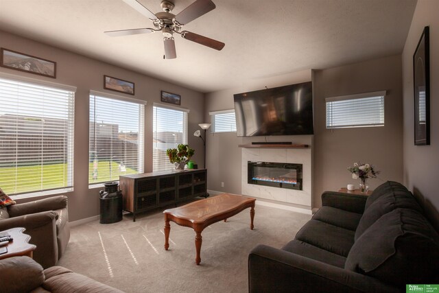 6311 N 169th St, Omaha, NE 68116 - living room with carpet flooring, a ceiling fan, a fireplace, and baseboards