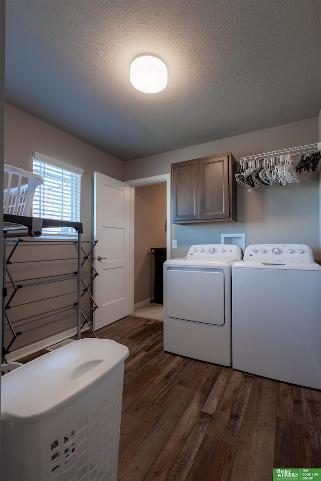 6311 N 169th St, Omaha, NE 68116 - laundry room featuring cabinet space, independent washer and dryer, dark wood finished floors, and a textured ceiling