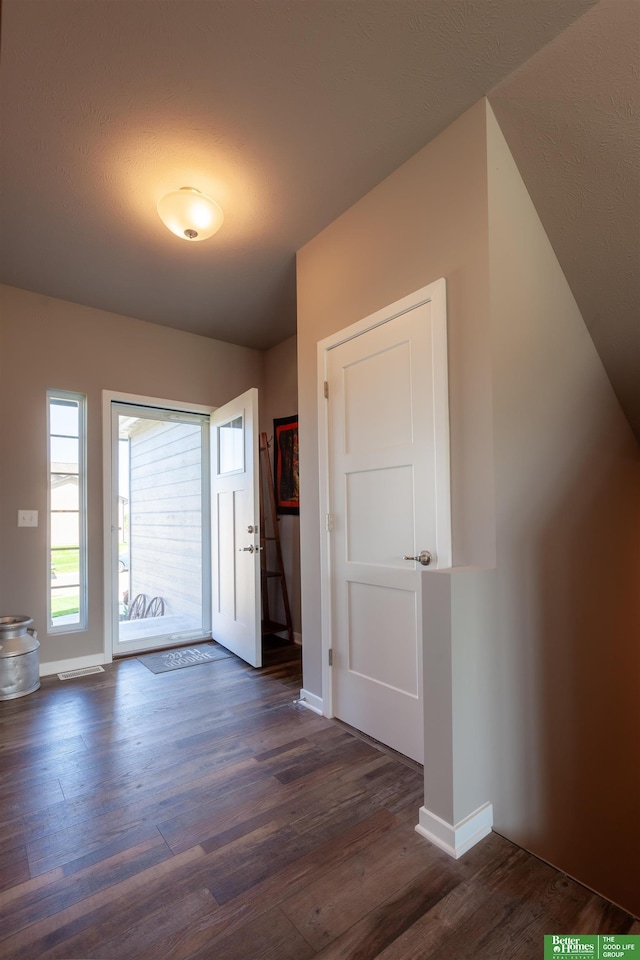 6311 N 169th St, Omaha, NE 68116 - entryway featuring dark wood-type flooring and baseboards