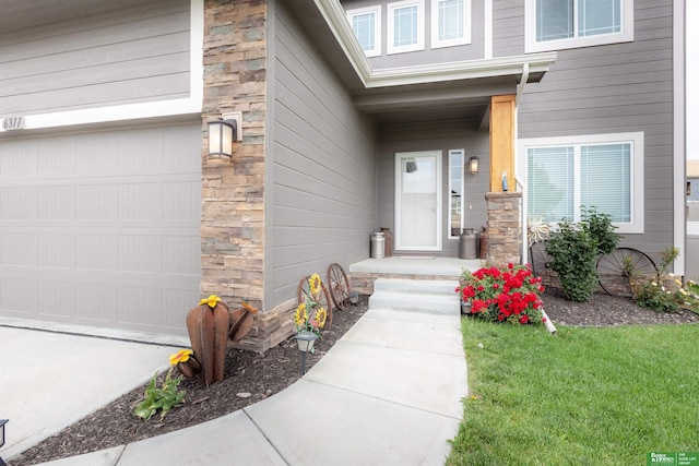 6311 N 169th St, Omaha, NE 68116 - entrance to property with a garage and stone siding