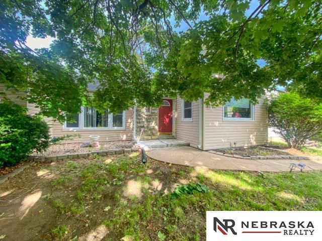 4816 N 60th St, Omaha, NE 68104 - view of property hidden behind natural elements