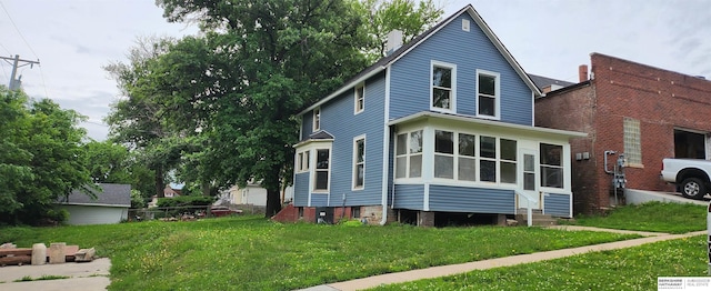 2319 B St, Omaha, NE 68108 - view of property exterior featuring a lawn and entry steps
