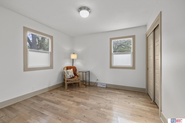 1141 S 48th St, Lincoln, NE 68510 - sitting room featuring light wood-style floors and baseboards