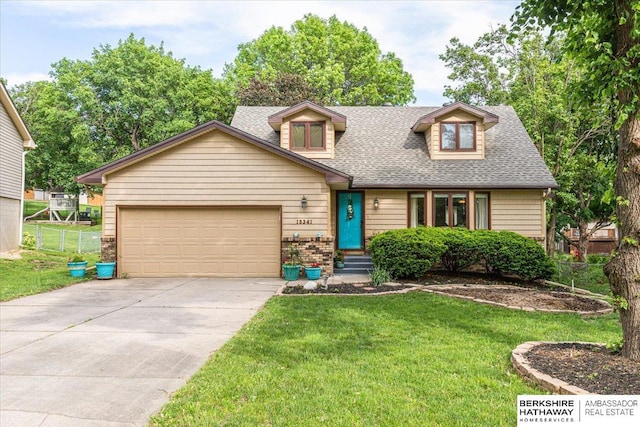 15341 Davenport Cir, Omaha, NE 68154 - view of front of house featuring roof with shingles, concrete driveway, an attached garage, and entry steps
