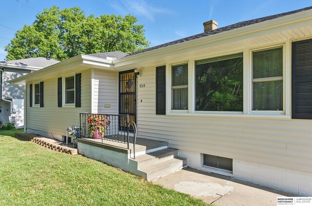 4314 Oak St, Omaha, NE 68105 - entrance to property with a yard and a chimney