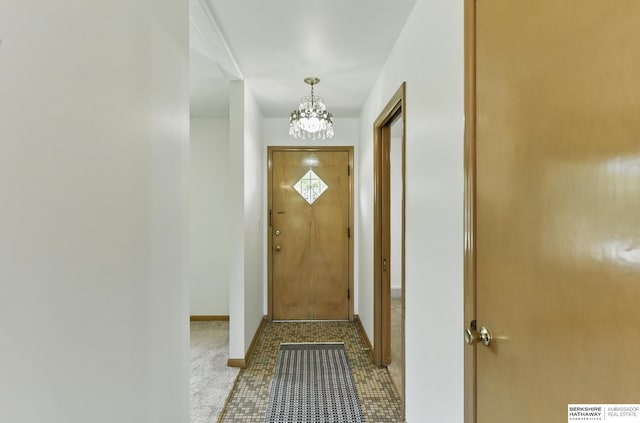 4314 Oak St, Omaha, NE 68105 - entryway featuring a chandelier and baseboards