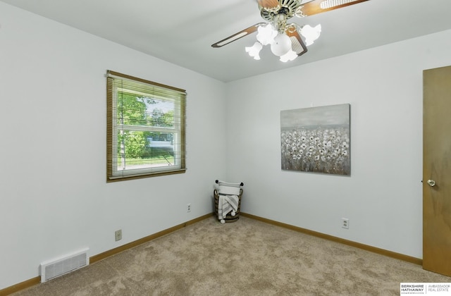 4314 Oak St, Omaha, NE 68105 - spare room with carpet, baseboards, and a ceiling fan