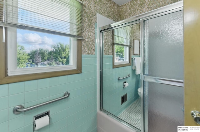 4314 Oak St, Omaha, NE 68105 - full bathroom with a shower with door, tile walls, and toilet