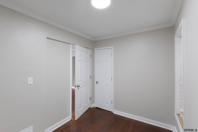 3013 Decatur St, Omaha, NE 68111 - unfurnished bedroom with dark wood-style floors, crown molding, and baseboards