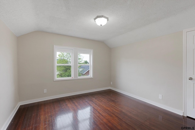3013 Decatur St, Omaha, NE 68111 - bonus room with vaulted ceiling, dark wood-type flooring, a textured ceiling, and baseboards