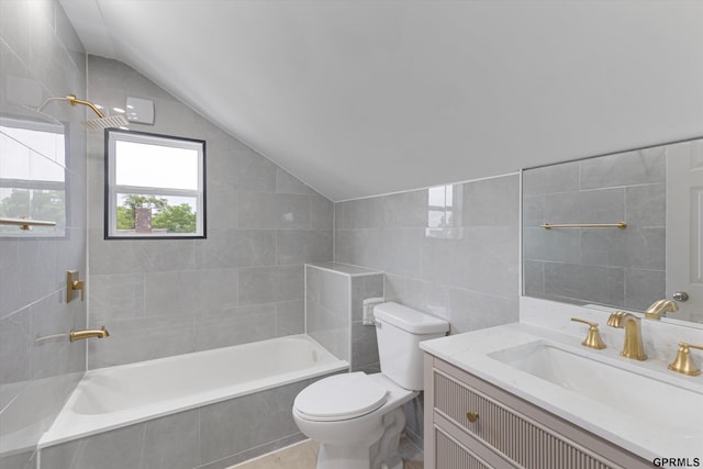 3013 Decatur St, Omaha, NE 68111 - bathroom featuring tile walls, vaulted ceiling, toilet, vanity, and tiled shower / bath