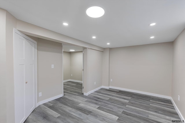3013 Decatur St, Omaha, NE 68111 - finished basement with recessed lighting, wood finished floors, and baseboards
