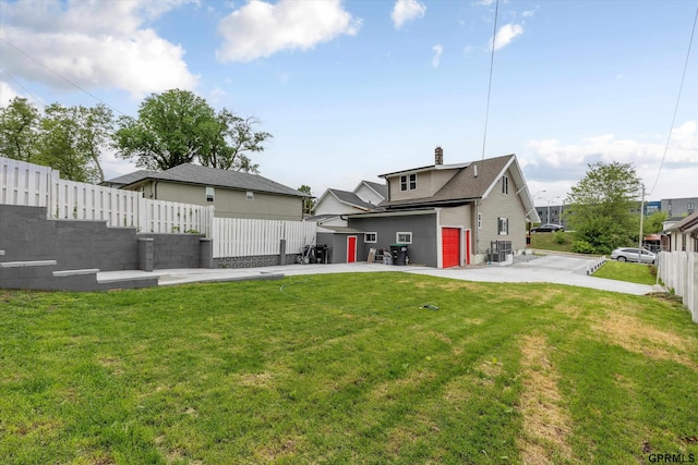 3013 Decatur St, Omaha, NE 68111 - rear view of property with central air condition unit, a chimney, and a patio