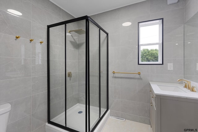 3013 Decatur St, Omaha, NE 68111 - full bathroom with tile walls, vanity, toilet, and a shower stall