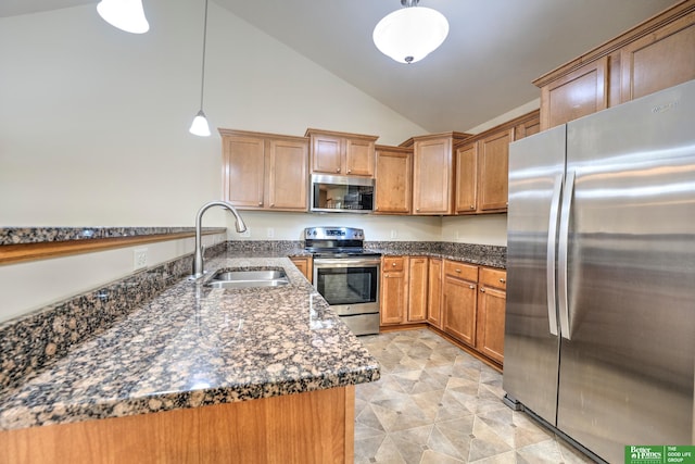 6200 Maple View Dr, Lincoln, NE 68512 - kitchen with appliances with stainless steel finishes, a sink, dark stone counters, pendant lighting, and a peninsula