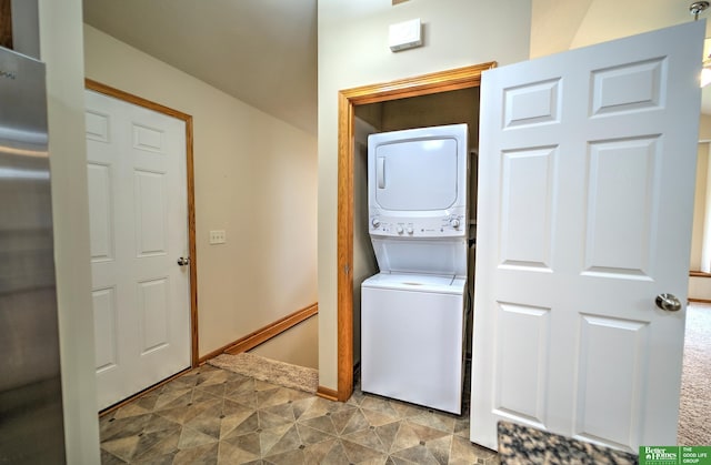 6200 Maple View Dr, Lincoln, NE 68512 - laundry room featuring stacked washer / dryer and baseboards