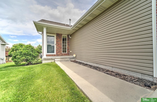6200 Maple View Dr, Lincoln, NE 68512 - doorway to property with a yard and brick siding