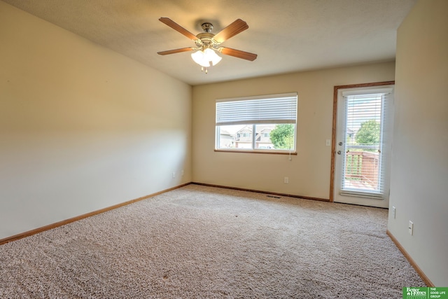 6200 Maple View Dr, Lincoln, NE 68512 - unfurnished room featuring light colored carpet, baseboards, and a ceiling fan