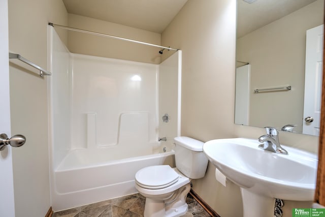 6200 Maple View Dr, Lincoln, NE 68512 - bathroom featuring toilet, washtub / shower combination, and a sink