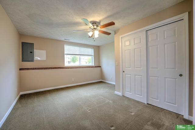 6200 Maple View Dr, Lincoln, NE 68512 - unfurnished bedroom featuring electric panel, carpet floors, baseboards, a closet, and ceiling fan
