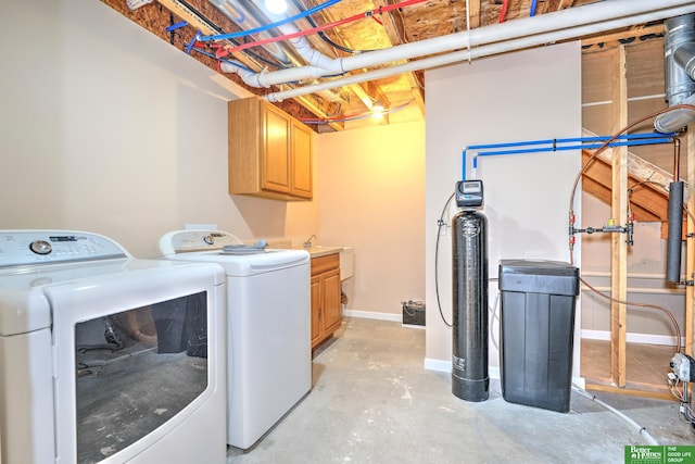 6200 Maple View Dr, Lincoln, NE 68512 - laundry room featuring washing machine and dryer, cabinet space, and baseboards