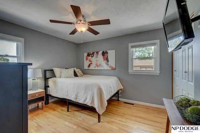 4705 N 95th St, Omaha, NE 68134 - bedroom featuring baseboards, wood finished floors, and a ceiling fan