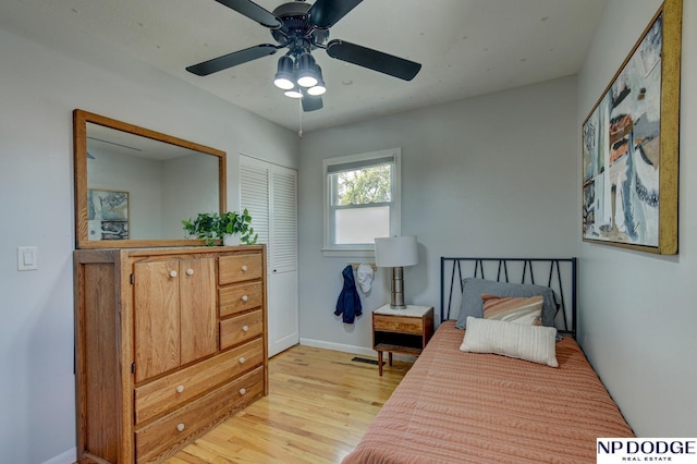 4705 N 95th St, Omaha, NE 68134 - bedroom with light wood finished floors, baseboards, ceiling fan, and a closet