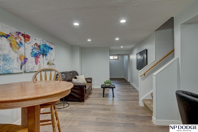 4705 N 95th St, Omaha, NE 68134 - dining area with stairs, light wood-style flooring, recessed lighting, a textured ceiling, and baseboards
