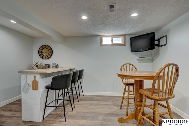 4705 N 95th St, Omaha, NE 68134 - indoor dry bar with a textured ceiling, baseboards, wood finished floors, and recessed lighting