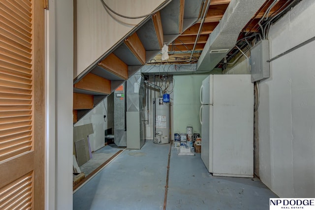 4705 N 95th St, Omaha, NE 68134 - unfinished basement featuring freestanding refrigerator, gas water heater, electric panel, and heating unit