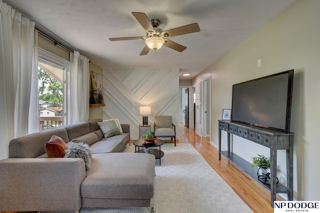 4705 N 95th St, Omaha, NE 68134 - living room featuring light wood finished floors, ceiling fan, and baseboards