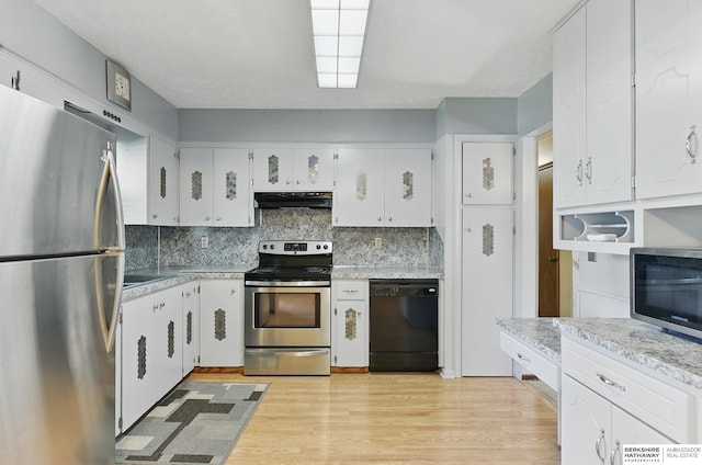 128 S 110th St, Omaha, NE 68154 - kitchen featuring appliances with stainless steel finishes, under cabinet range hood, tasteful backsplash, white cabinets, and light wood-type flooring