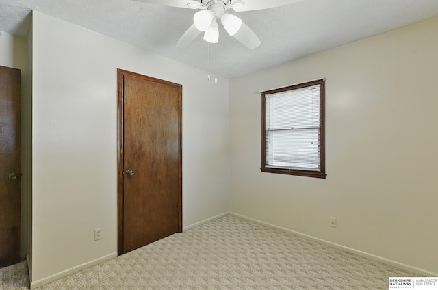 128 S 110th St, Omaha, NE 68154 - unfurnished bedroom with carpet floors, baseboards, and a ceiling fan