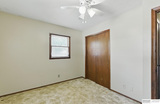 128 S 110th St, Omaha, NE 68154 - unfurnished bedroom featuring carpet flooring, baseboards, a closet, and ceiling fan