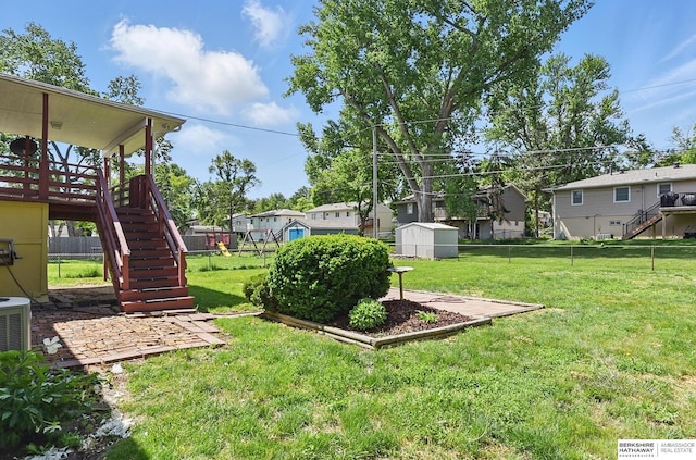 128 S 110th St, Omaha, NE 68154 - view of yard featuring stairway, a deck, and central air condition unit