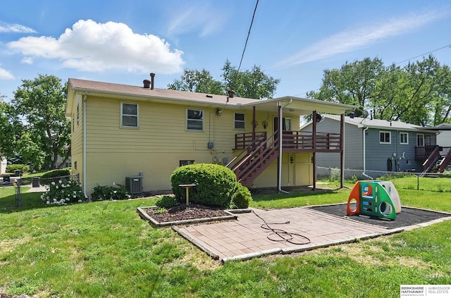 128 S 110th St, Omaha, NE 68154 - back of house featuring stairway, central air condition unit, and a patio area
