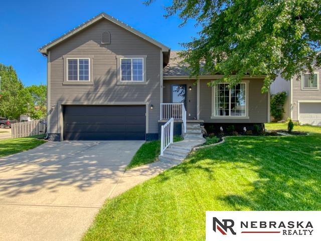 14603 Nebraska Cir, Omaha, NE 68116 - tri-level home featuring an attached garage and driveway