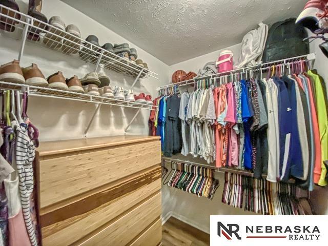 14603 Nebraska Cir, Omaha, NE 68116 - spacious closet featuring wood finished floors