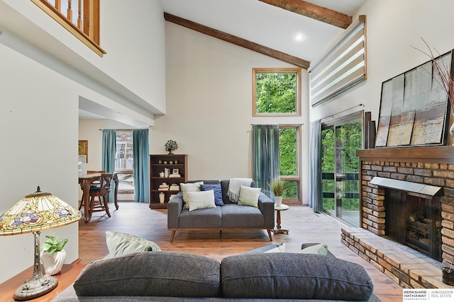 301 Oakridge Ct, Bellevue, NE 68005 - living area featuring high vaulted ceiling, wood finished floors, beam ceiling, a fireplace, and recessed lighting