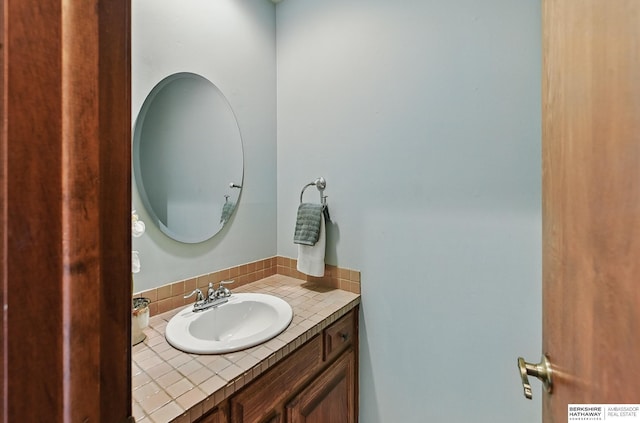 301 Oakridge Ct, Bellevue, NE 68005 - bathroom featuring vanity and backsplash