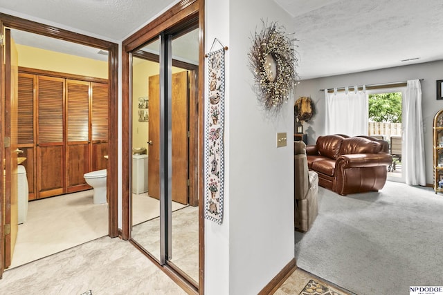 13952 Frederick Cir, Omaha, NE 68138 - hallway with a textured ceiling and light carpet