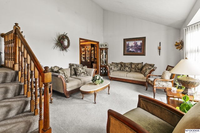 13952 Frederick Cir, Omaha, NE 68138 - carpeted living room with high vaulted ceiling and stairway
