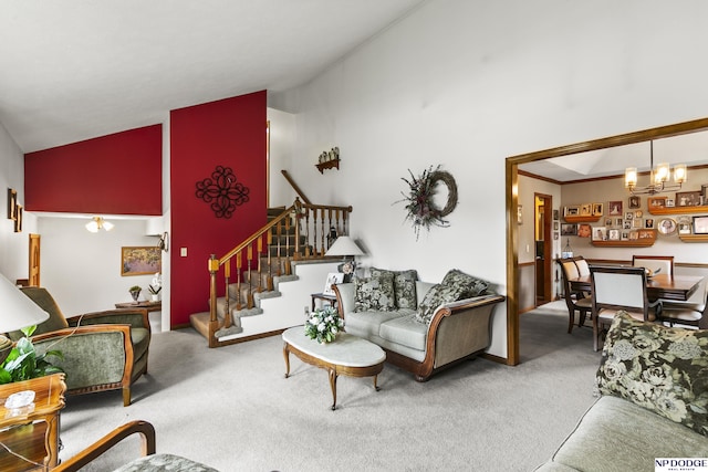 13952 Frederick Cir, Omaha, NE 68138 - carpeted living area with high vaulted ceiling, stairs, and a chandelier