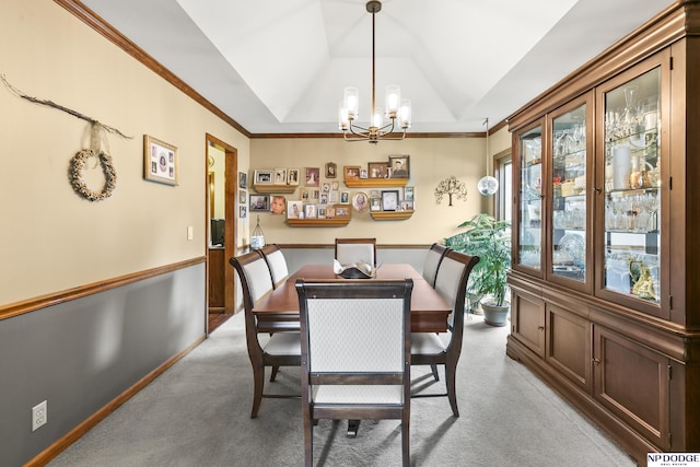 13952 Frederick Cir, Omaha, NE 68138 - dining area featuring a chandelier, light carpet, and lofted ceiling