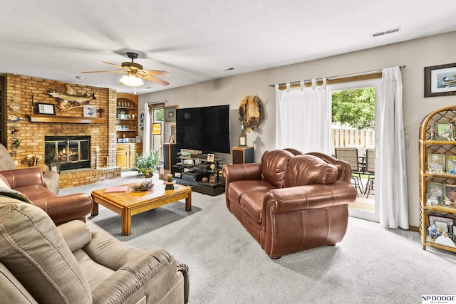 13952 Frederick Cir, Omaha, NE 68138 - living area with ceiling fan, carpet flooring, and a brick fireplace